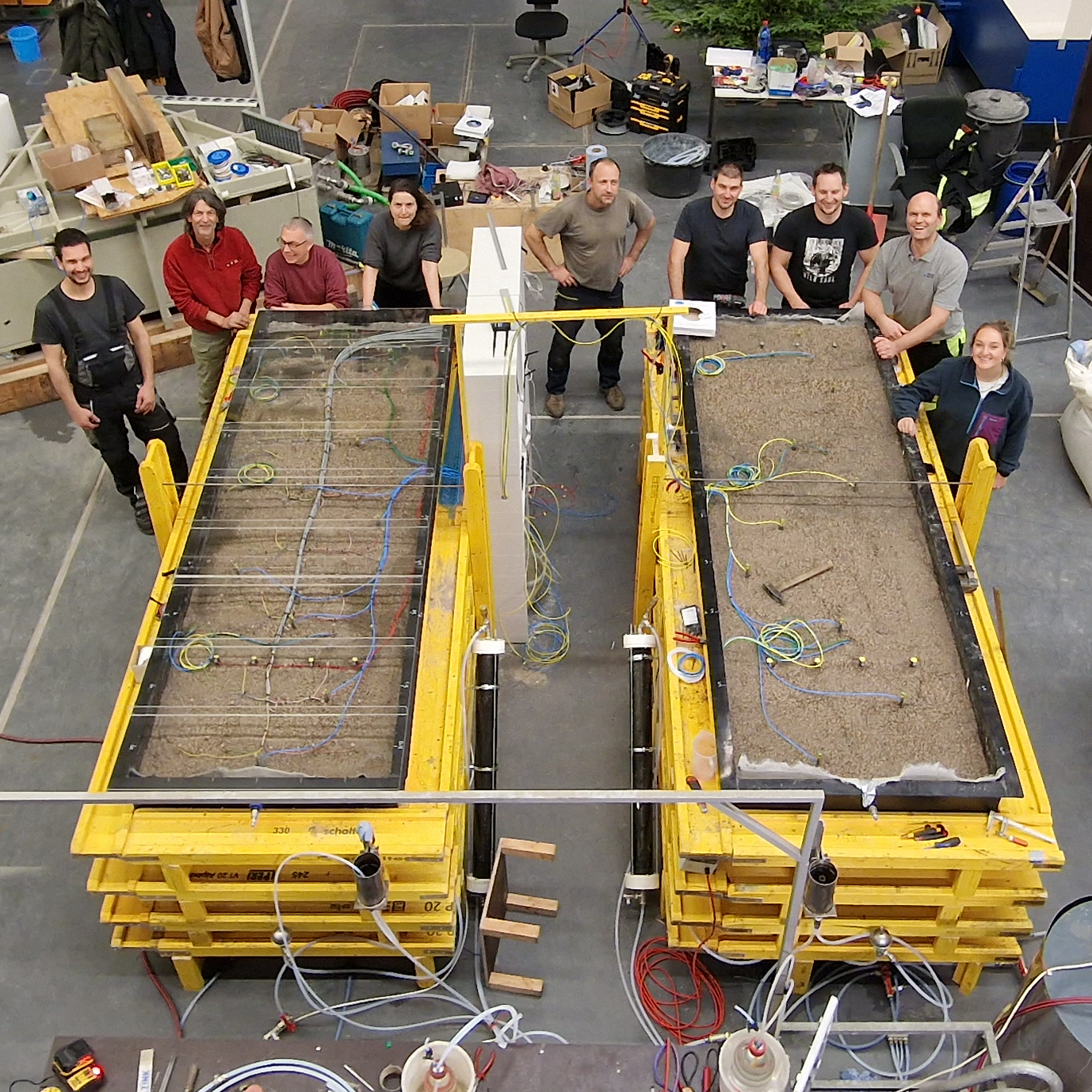 Team of EiCLaR stands around the newly set up experiments
