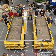 Team of EiCLaR stands around the newly set up experiments
